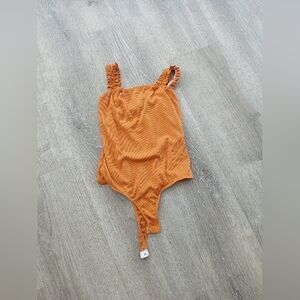 2 saints body suit